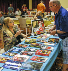 Audrey Parente (left) talks with a customer at Pulp AdventureCon 2016 in Fort Lauderdale. (Photo courtesy of Mike Hunter)