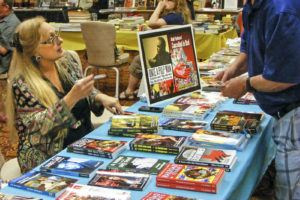 Audrey Parente (left) talks with a customer at Pulp AdventureCon 2016 in Fort Lauderdale. (Photo courtesy of Mike Hunter)