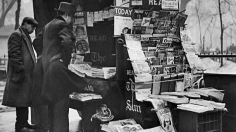 From March 1934, a news vendor’s stand in New York’s Madison Square Park offers several pulp magazines for sale.