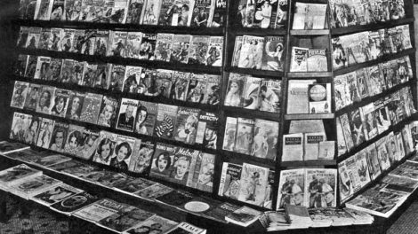 This newsstand (location unknown) displays pulps with cover dates of May and June 1935.