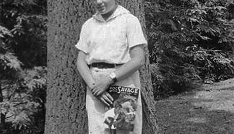 Here's a kid who has some reading fun ahead of him. He's holding the August 1935 number of "Doc Savage Magazine." (Courtesy of Victor De Long.)