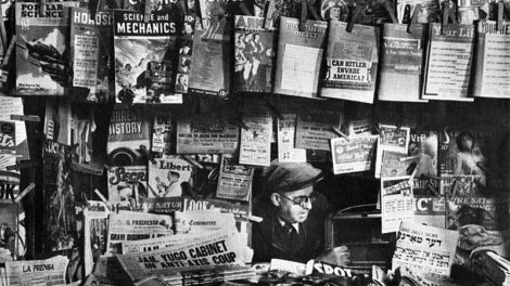 There are plenty of comics and other magazines, but very few pulps visible on this newsstand. But if you look closely, you'll see the corner of the April 5, 1941, number of "Detective Fiction Weekly" hanging just above the "Liberty" magazine.