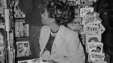 A young woman waits at a comic book and magazine rack in late 1948. On display behind her are November 1948 numbers of "Dime Detective Stories," "G-Men Detective," "Phantom Detective" and other pulps.