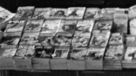 In this fuzzy detail of the previous Union Station photo, you can make out stacks of "Argosy" (February 1943), "Adventure" (February 1943), "Black Mask" (March 1943), "The Spider" (February 1943), "Love Stories" and several detective pulps.