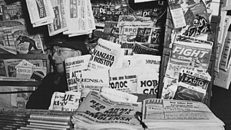 From January 1943, a newsstand on Fourth Avenue at 14th Street, New York, specializes in foreign newspapers, but also includes a few sports and detective pulps in the background.
