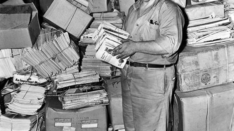 The caption from this July 1944 photo reads: "Frank Estis stands in a Chicago street with a small part of his 10 tons of reading matter — 'Pathfinder,' 'Liberty,' 'Saturday Evening Post,' 'True Confessions,' 'Horror Stories,' and other magazines — which were part of movers backache as the 50-year-old World War I veteran was evicted from his home when his lady found his literary collection prevented her keeping fire insurance." Only the spines of two pulps are partly visible — "Complete Western Book Magazine" and "Fifteen Western Stories" — but are extremely difficult to see.