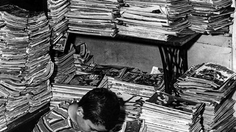 While this kid is focused on the comics, a pulp fan would be looking through the stack of untrimmed pulp magazines just behind his right shoulder. There's a "Dime Mystery" at the top of the stack. More pulps are stacked on the shelves above his head, including issues of "Captain Future," "Planet Stories," "Blue Book," and "Western Tales," but they are mixed in with a variety of other magazines. This photo of a used-magazine shop in Wellston, Mo., is from 1946.