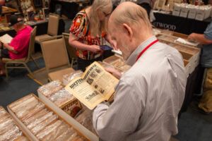 Browsing the dealers' room at PulpFest 2023