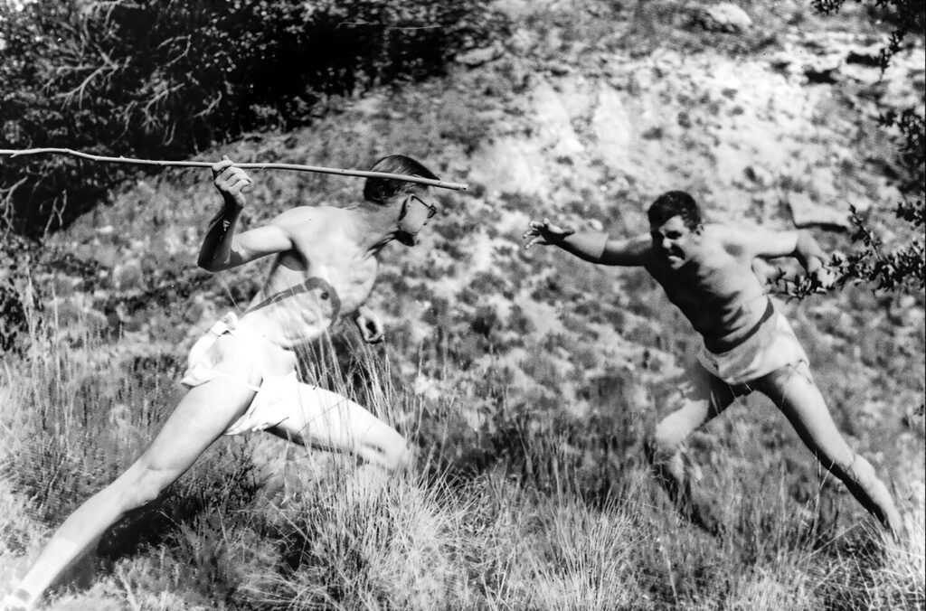 Robert E. Howard (right) spars with friend and writer Tevis Clyde Smith as they re-enact a scene from “Spear and Fang.”