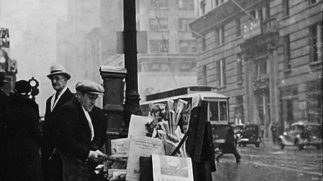 It's sometime in the 1930s, and this street-side newsstand is touting "The Shadow" magazine with a promotional poster. (From the Dwight Fuhro collection)
