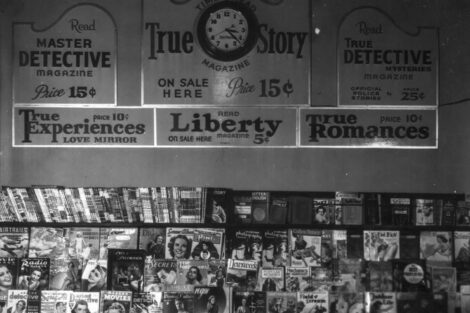 At another Tacoma, Wash., shop, the spines of pulp magazines line the top shelf of this magazine rack in February 1938.